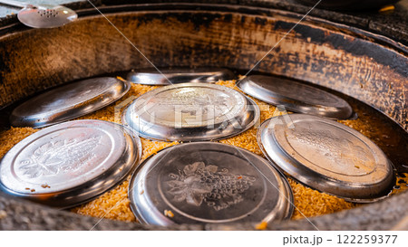 The concept of oriental cuisine. Assorted Uzbek food set, pilaf, samsa, lagman, manta, shurpa central asia food. Homemade Uzbek pilaf or plov from lamb served in cast iron cookware 122259377