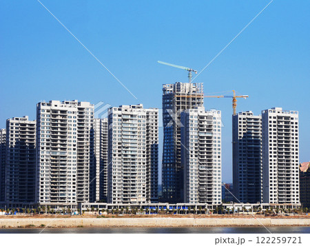construction site with crane, Tower Crane Operating At Development Site, City, crane and construction with apartment buildings, property development, infrastructure, Urban landscape, civil engineering construction site with crane, Tower Crane Operating At Development Site, City, crane and construction with apartment buildings, property development, infrastructure, Urban landscape, civil engineering 122259721