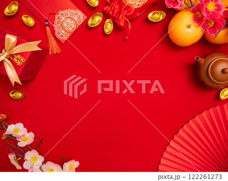flat lay of lucky item decoration ornament for Chinese Lunar New Year celebration red background with ancient Chinese gold bar, gift box , paper hand fan, Tae Eia envelope (red envelope), orange, plum flat lay of lucky item decoration ornament for Chinese Lunar New Year celebration red background with ancient Chinese gold bar, gift box , paper hand fan, Tae Eia envelope (red envelope), orange, plum 122261273