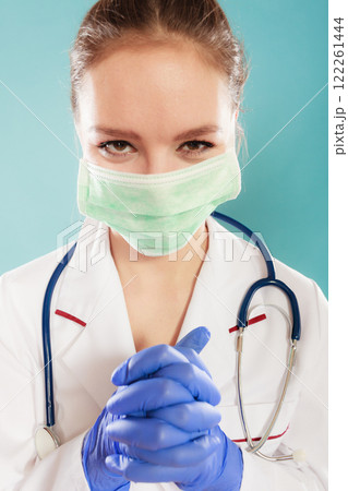 Portrait of female doctor in mask Portrait of female doctor in mask 122261444