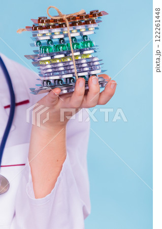 Woman with diet weight loss pills. 122261448