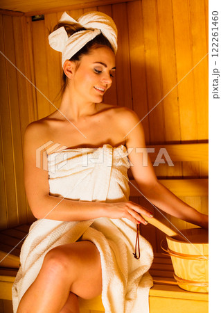 Woman white towel in sauna room 122261460