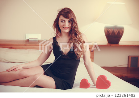 Woman in lingerie in bed. Valentines day love. Woman in lingerie in bed. Valentines day love. 122261482