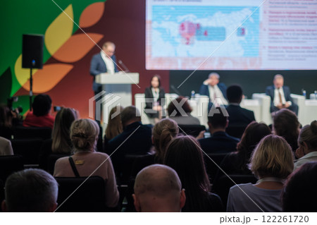 Audience attentively listening to speaker at business conference event 122261720