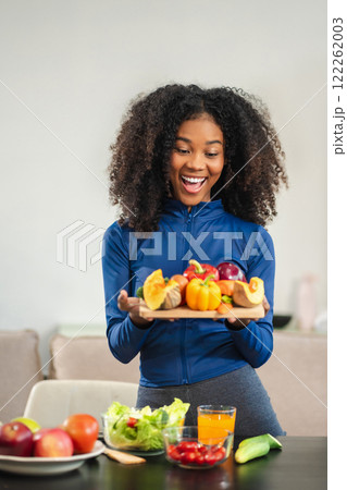 Lifestyle woman enjoys healthy fruit breakfast after yoga training. fitness, nutrition, home lifestyle. Lifestyle woman enjoys healthy fruit breakfast after yoga training. fitness, nutrition, home lifestyle. 122262003