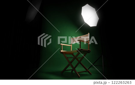 Photo studio with green screen background and stool against lighting equipment. 122263263