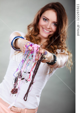 Happy woman with jewelry necklaces ring bracelets Happy woman with jewelry necklaces ring bracelets 122265921
