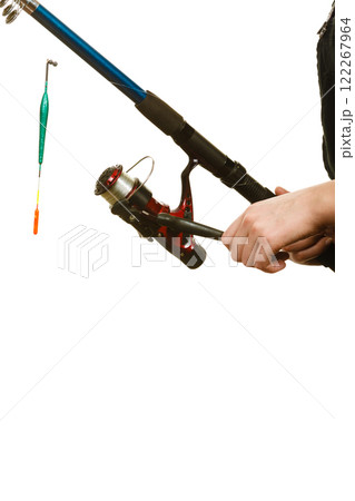 Woman holding fishing rod with float Woman holding fishing rod with float 122267964