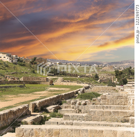 Roman ruins (against the background of a beautiful sky with clouds) in the Jordanian city of Jerash (Gerasa of Antiquity), capital and largest city of Jerash Governorate, Jordan Roman ruins (against the background of a beautiful sky with clouds) in the Jordanian city of Jerash (Gerasa of Antiquity), capital and largest city of Jerash Governorate, Jordan 122269773
