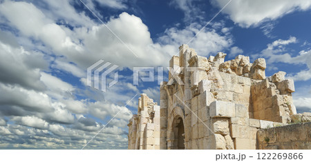 Roman ruins (against the background of a beautiful sky with clouds) in the Jordanian city of Jerash (Gerasa of Antiquity), capital and largest city of Jerash Governorate, Jordan Roman ruins (against the background of a beautiful sky with clouds) in the Jordanian city of Jerash (Gerasa of Antiquity), capital and largest city of Jerash Governorate, Jordan 122269866
