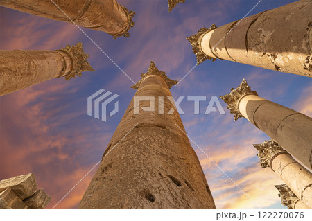 Roman Columns in the Jordanian city of Jerash (Gerasa of Antiquity), capital and largest city of Jerash Governorate, Jordan. Against the background of a beautiful sky with clouds Roman Columns in the Jordanian city of Jerash (Gerasa of Antiquity), capital and largest city of Jerash Governorate, Jordan. Against the background of a beautiful sky with clouds 122270076