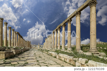 Roman Columns in the Jordanian city of Jerash (Gerasa of Antiquity), capital and largest city of Jerash Governorate, Jordan. Against the background of a beautiful sky with clouds Roman Columns in the Jordanian city of Jerash (Gerasa of Antiquity), capital and largest city of Jerash Governorate, Jordan. Against the background of a beautiful sky with clouds 122270109