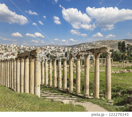 Roman Columns in the Jordanian city of Jerash (Gerasa of Antiquity), capital and largest city of Jerash Governorate, Jordan. Against the background of a beautiful sky with clouds Roman Columns in the Jordanian city of Jerash (Gerasa of Antiquity), capital and largest city of Jerash Governorate, Jordan. Against the background of a beautiful sky with clouds 122270143