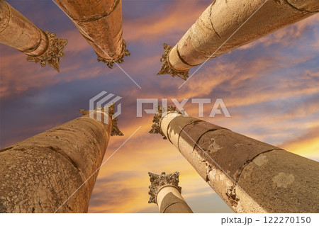 Roman Columns in the Jordanian city of Jerash (Gerasa of Antiquity), capital and largest city of Jerash Governorate, Jordan. Against the background of a beautiful sky with clouds 122270150
