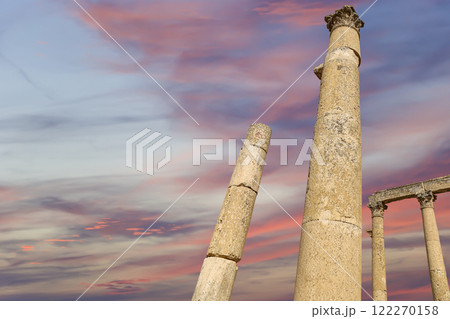 Roman Columns in the Jordanian city of Jerash (Gerasa of Antiquity), capital and largest city of Jerash Governorate, Jordan. Against the background of a beautiful sky with clouds 122270158