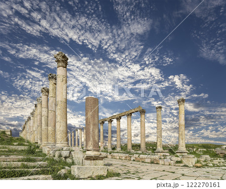 Roman Columns in the Jordanian city of Jerash (Gerasa of Antiquity), capital and largest city of Jerash Governorate, Jordan. Against the background of a beautiful sky with clouds 122270161