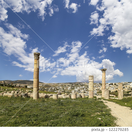 Roman ruins (against the background of a beautiful sky with clouds) in the Jordanian city of Jerash (Gerasa of Antiquity), capital and largest city of Jerash Governorate, Jordan Roman ruins (against the background of a beautiful sky with clouds) in the Jordanian city of Jerash (Gerasa of Antiquity), capital and largest city of Jerash Governorate, Jordan 122270285