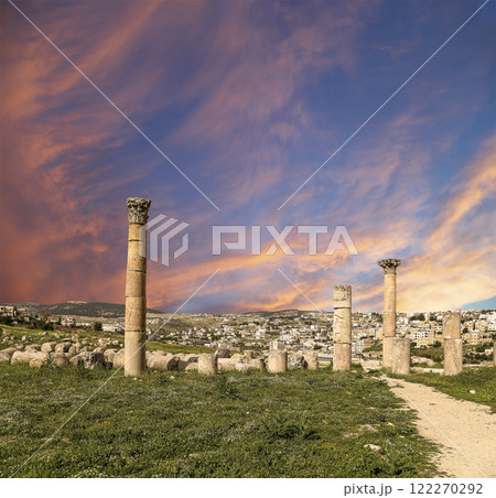 Roman ruins (against the background of a beautiful sky with clouds) in the Jordanian city of Jerash (Gerasa of Antiquity), capital and largest city of Jerash Governorate, Jordan Roman ruins (against the background of a beautiful sky with clouds) in the Jordanian city of Jerash (Gerasa of Antiquity), capital and largest city of Jerash Governorate, Jordan 122270292