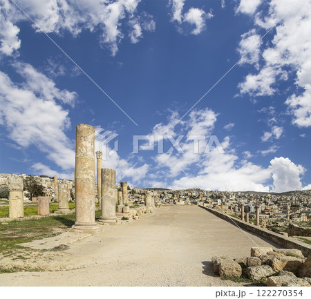 Roman ruins (against the background of a beautiful sky with clouds) in the Jordanian city of Jerash (Gerasa of Antiquity), capital and largest city of Jerash Governorate, Jordan Roman ruins (against the background of a beautiful sky with clouds) in the Jordanian city of Jerash (Gerasa of Antiquity), capital and largest city of Jerash Governorate, Jordan 122270354