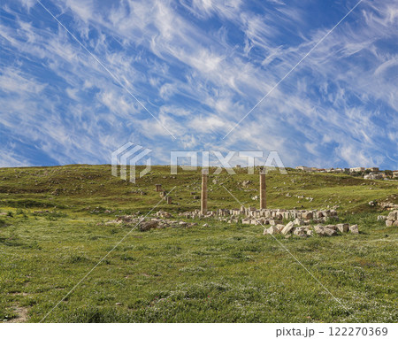 Roman ruins (against the background of a beautiful sky with clouds) in the Jordanian city of Jerash (Gerasa of Antiquity), capital and largest city of Jerash Governorate, Jordan Roman ruins (against the background of a beautiful sky with clouds) in the Jordanian city of Jerash (Gerasa of Antiquity), capital and largest city of Jerash Governorate, Jordan 122270369