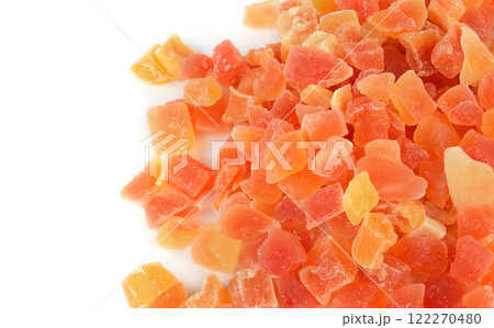 Dried pieces of papaya, close-up, isolated on white background. 122270480