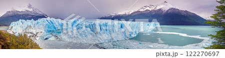 Perito Moreno Glacier with its dramatic icy wall and surrounding snowy mountains in Patagonia 122270697