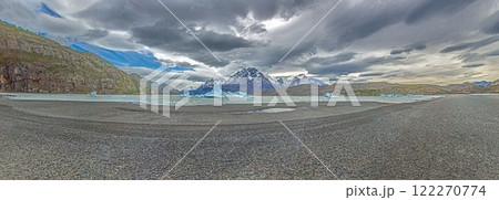 View from the far end of Lago Grey with icebergs and dramatic mountain backdrop in Torres del Paine 122270774