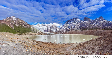 Panoramic view of Cerro Torre with lush foreground and dramatic snow capped mountains in Patagonia 122270775