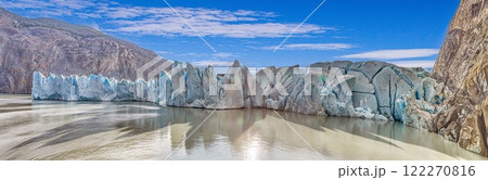 Closeup of Grey Glaciers calving front with icy peaks and reflections in Torres del Paine National Park 122270816