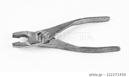 Classic pliers resting on a flat surface Classic pliers resting on a flat surface 122271430
