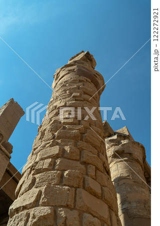 Egyptian column with blocks against the sky 122272921