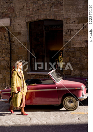 Stylish Woman by Vintage Car 122273116