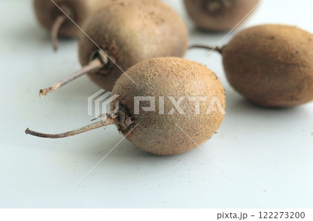 Group of kiwi with tails from home garden on white background. Eco-friendly pure natural product.  122273200