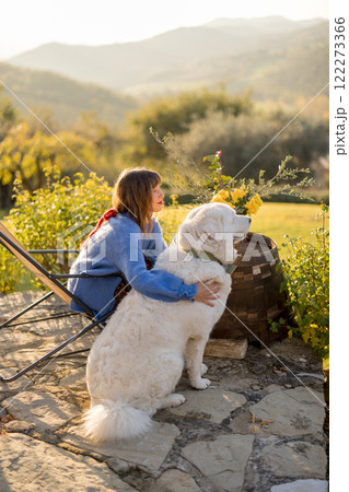 Woman and Dog Enjoying Countryside 122273366