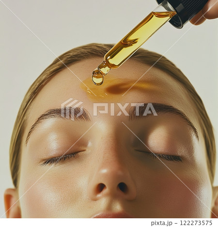 Relaxing spa facial oil application for skin care and rejuvenation Relaxing spa facial oil application for skin care and rejuvenation 122273575