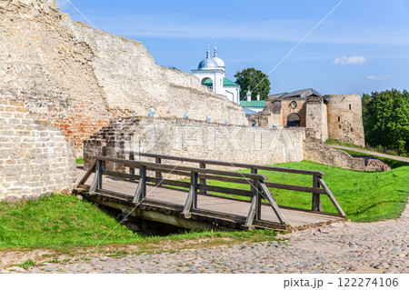 Ancient weathered rough stone walls and tower of the Izborsk fortress, Izborsk, Russia. Medieval castle of the 14th century 122274106