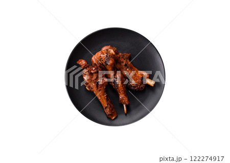 Ribs or rack of beef baked on the grill with salt, spices and herbs 122274917