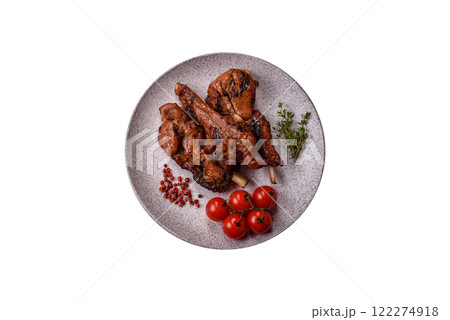 Ribs or rack of beef baked on the grill with salt, spices and herbs Ribs or rack of beef baked on the grill with salt, spices and herbs 122274918