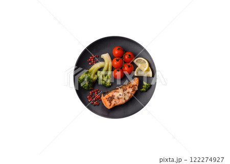Grilled salmon with salt and spices, broccoli, tomatoes, rice Grilled salmon with salt and spices, broccoli, tomatoes, rice 122274927