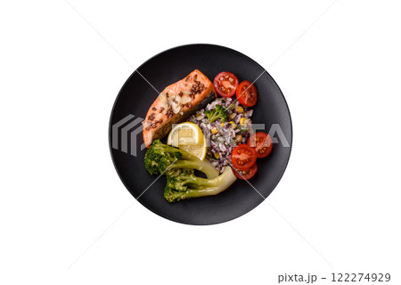 Grilled salmon with salt and spices, broccoli, tomatoes, rice Grilled salmon with salt and spices, broccoli, tomatoes, rice 122274929