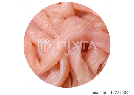 Raw chicken fillet cut into strips with spices and herbs Raw chicken fillet cut into strips with spices and herbs 122275004