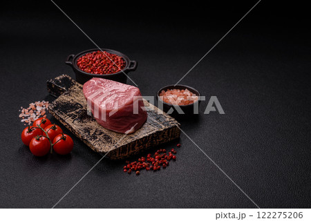 Ribeye steak raw with salt, spices and herbs Ribeye steak raw with salt, spices and herbs 122275206