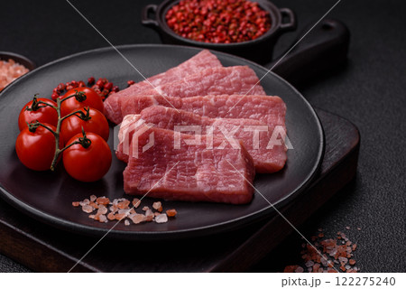 Juicy beef cut into slices with salt, spices and herbs Juicy beef cut into slices with salt, spices and herbs 122275240