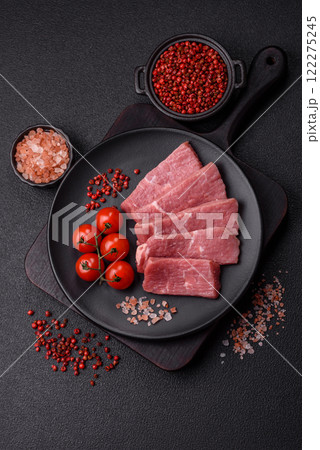 Juicy beef cut into slices with salt, spices and herbs Juicy beef cut into slices with salt, spices and herbs 122275245