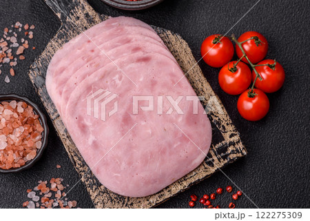 Ham, spam with salt, spices and herbs cut into slices Ham, spam with salt, spices and herbs cut into slices 122275309