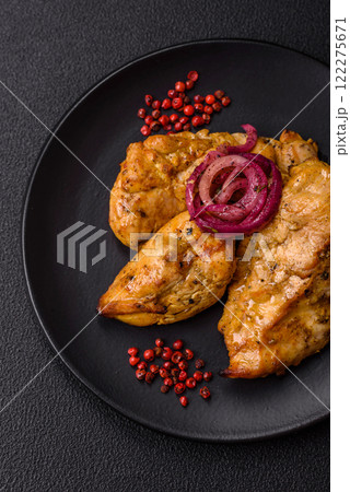 Chicken fillet pieces marinated with salt and spices 122275671