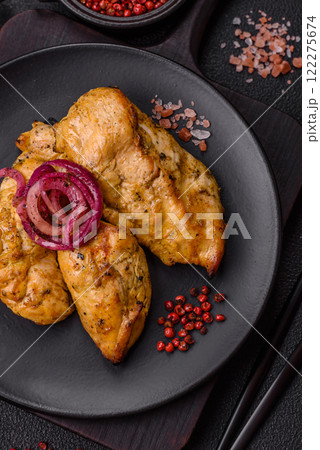 Chicken fillet pieces marinated with salt and spices 122275674