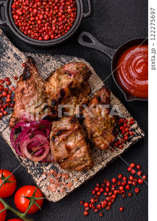 Pieces of beef meat cut into slices, marinated with salt and spices 122275697