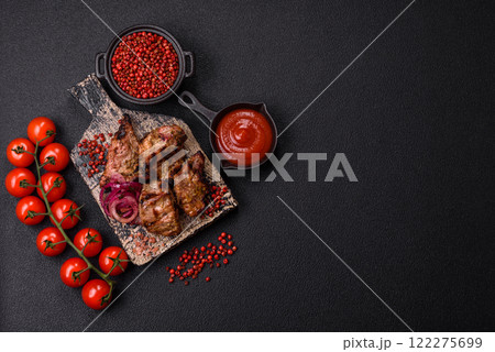 Pieces of beef meat cut into slices, marinated with salt and spices Pieces of beef meat cut into slices, marinated with salt and spices 122275699
