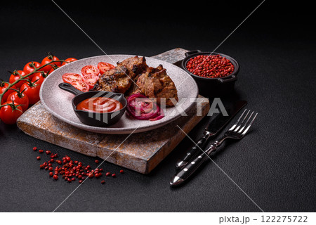 Pieces of beef meat cut into slices, marinated with salt and spices Pieces of beef meat cut into slices, marinated with salt and spices 122275722